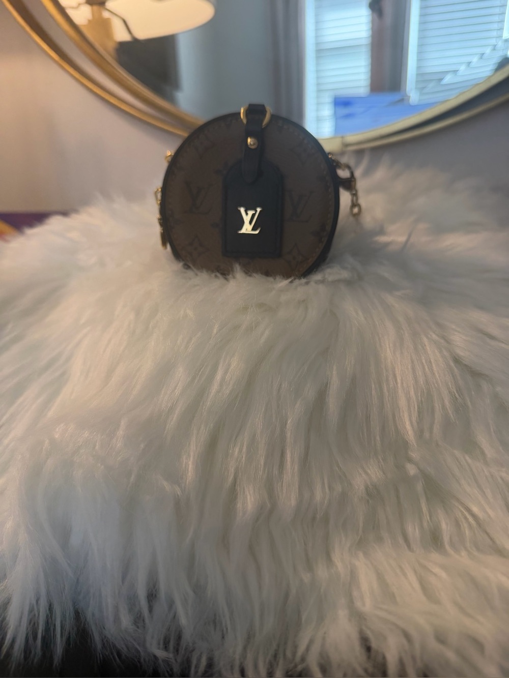 Louis Vuitton monogram reverse boite chapeau necklace.